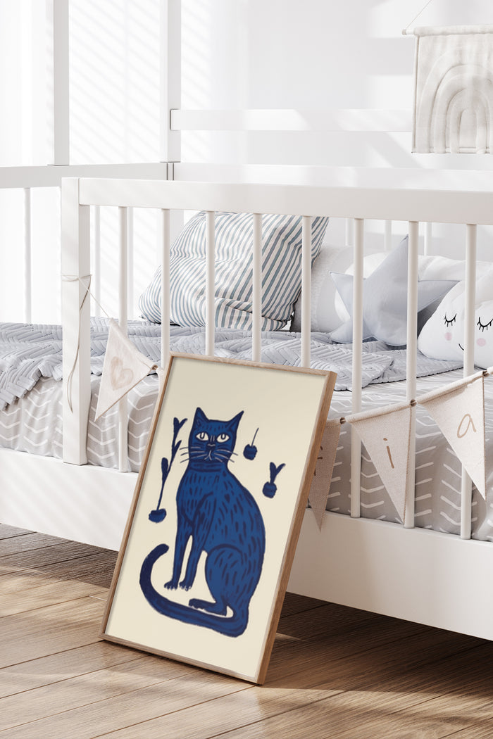 Stylish dark blue cat illustration poster propped against a white crib in a contemporary nursery room interior