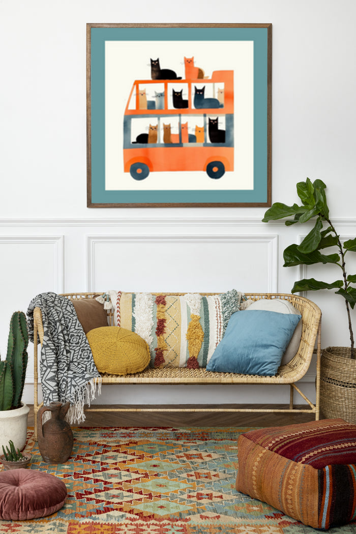 Modern art illustration poster featuring cats riding in an orange bus hung on a living room wall