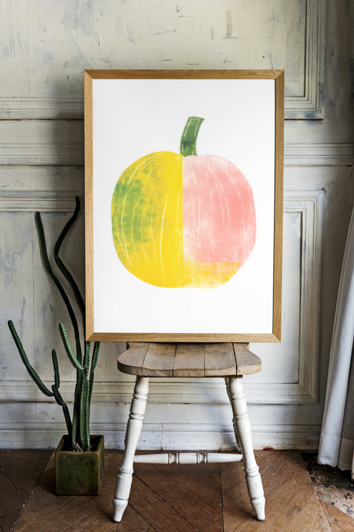 Colorful abstract pumpkin artwork poster on wooden easel for modern home decoration