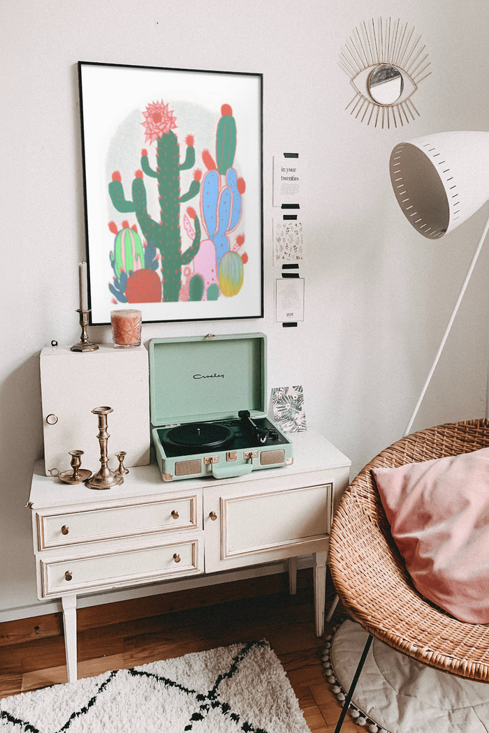 Stylish interior with colorful cactus poster, vintage turntable, and bohemian decorations