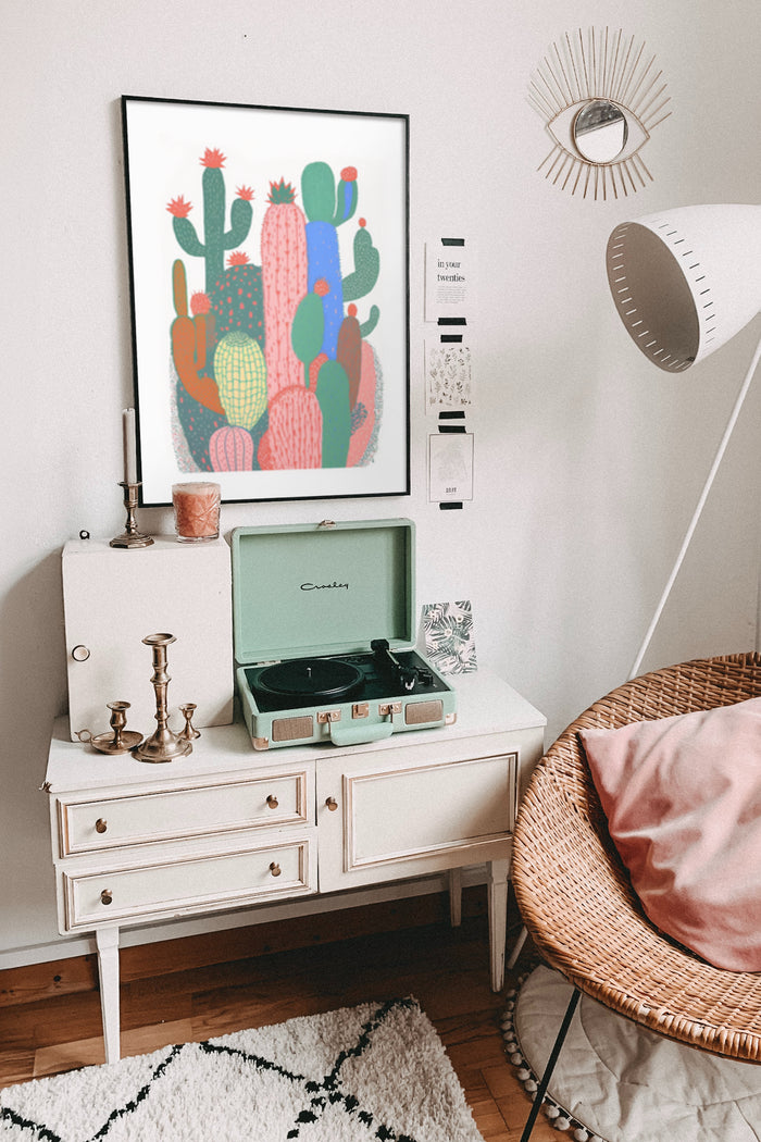 Colorful cactus artwork poster in stylish home interior with vintage record player and bohemian decorations