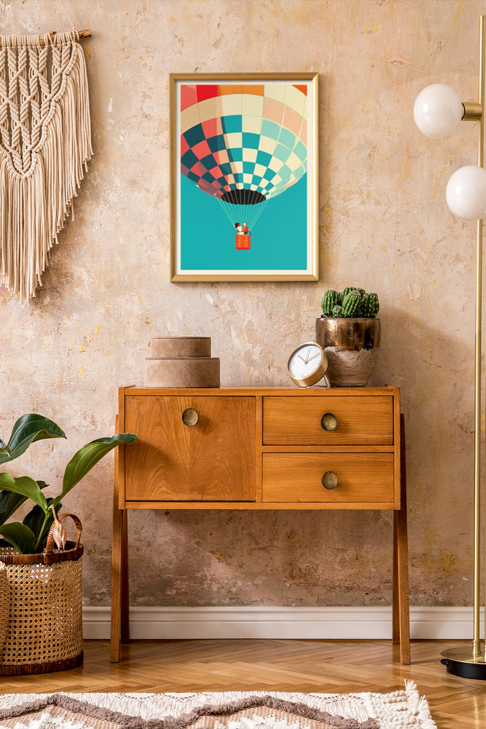 Colorful hot air balloon graphic poster on wall above wooden sideboard in stylish interior setting