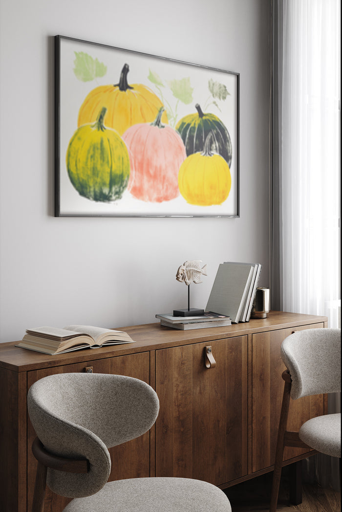Assorted watercolor pumpkin artwork on wall above wooden sideboard in contemporary office space