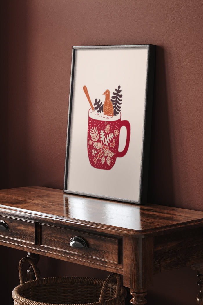 Framed poster of a red mug with winter designs and a bird on a wooden desk