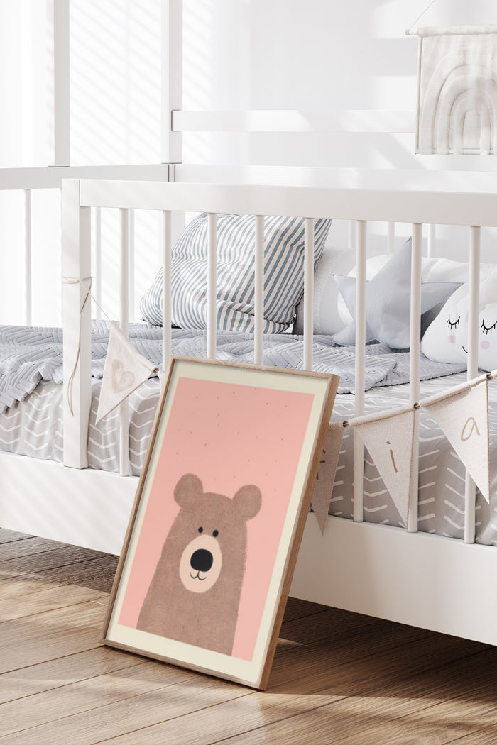 Adorable cartoon bear poster leaning against a white crib in a stylish baby nursery room