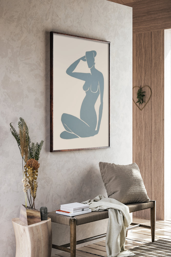 Minimalist artwork of a female silhouette on a poster in a modern interior setting