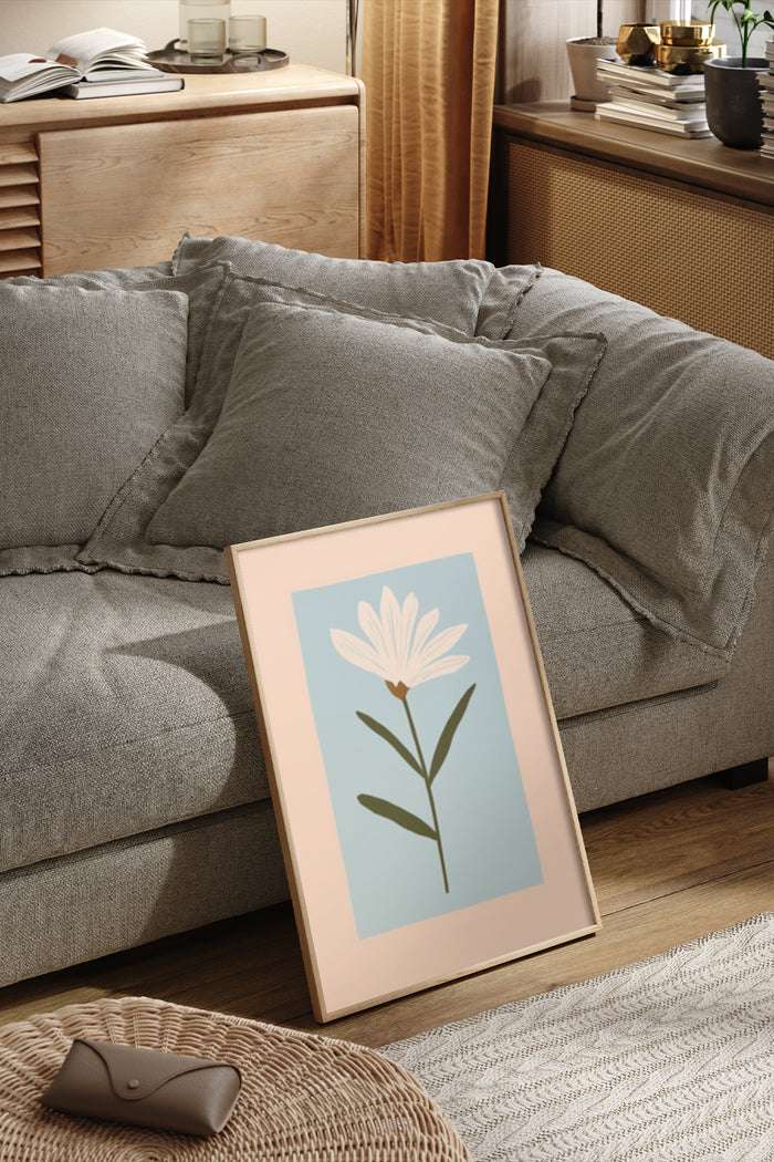 Minimalist floral artwork poster displayed in a modern living room setting