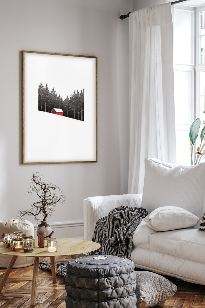Minimalist black and white forest with red cabin poster in a contemporary living room setting