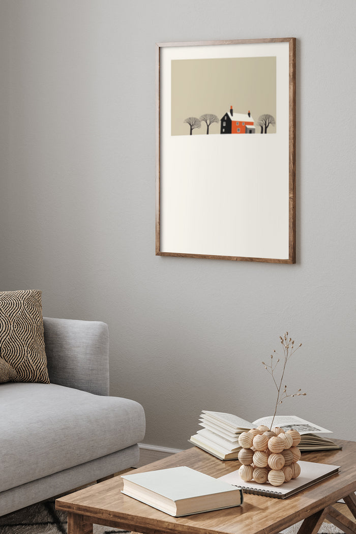 Minimalist landscape poster featuring a stylized house surrounded by trees, displayed in a modern living room setting