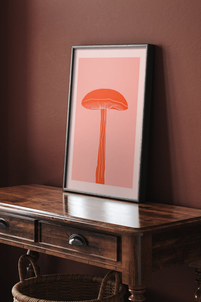 Minimalist red mushroom illustration on a pink background framed poster in a stylish interior