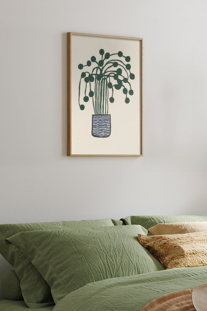 Modern minimalist houseplant illustration in a frame above a bed with green bedding