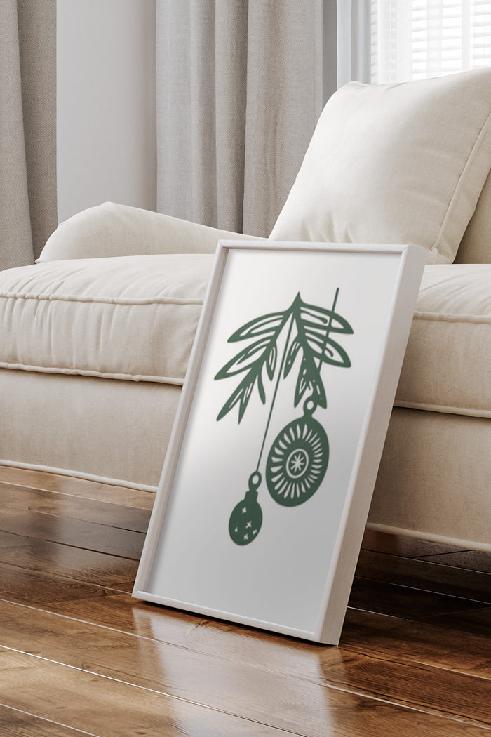 Contemporary minimalist poster with green plant and hanging ornaments leaning against wall in modern home interior