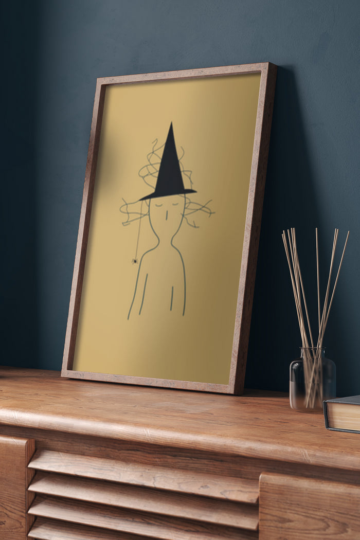 Contemporary minimalist witch line art poster framed and displayed on wooden sideboard