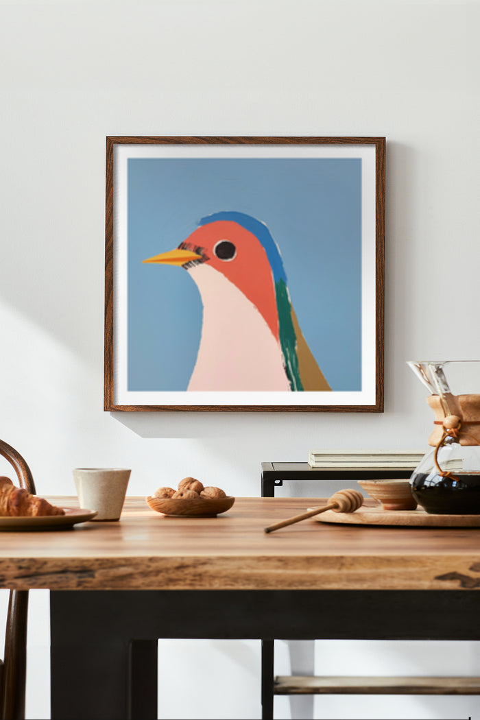 Colorful modern abstract bird artwork framed poster on wall above a stylish breakfast table setting