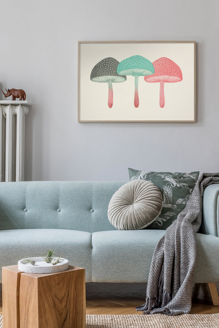 Abstract pastel mushroom trio poster above blue sofa in contemporary living room decor