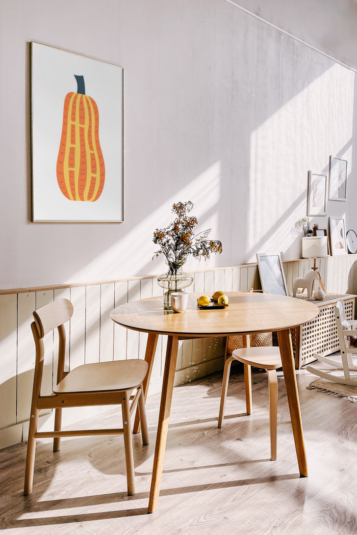 Stylish dining room with sunlight featuring a modern abstract squash poster on the wall