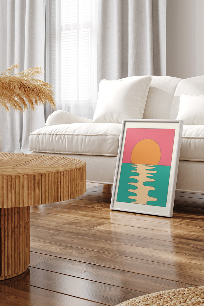 Stylish abstract sunset artwork poster leaning against wall in modern home decor setting