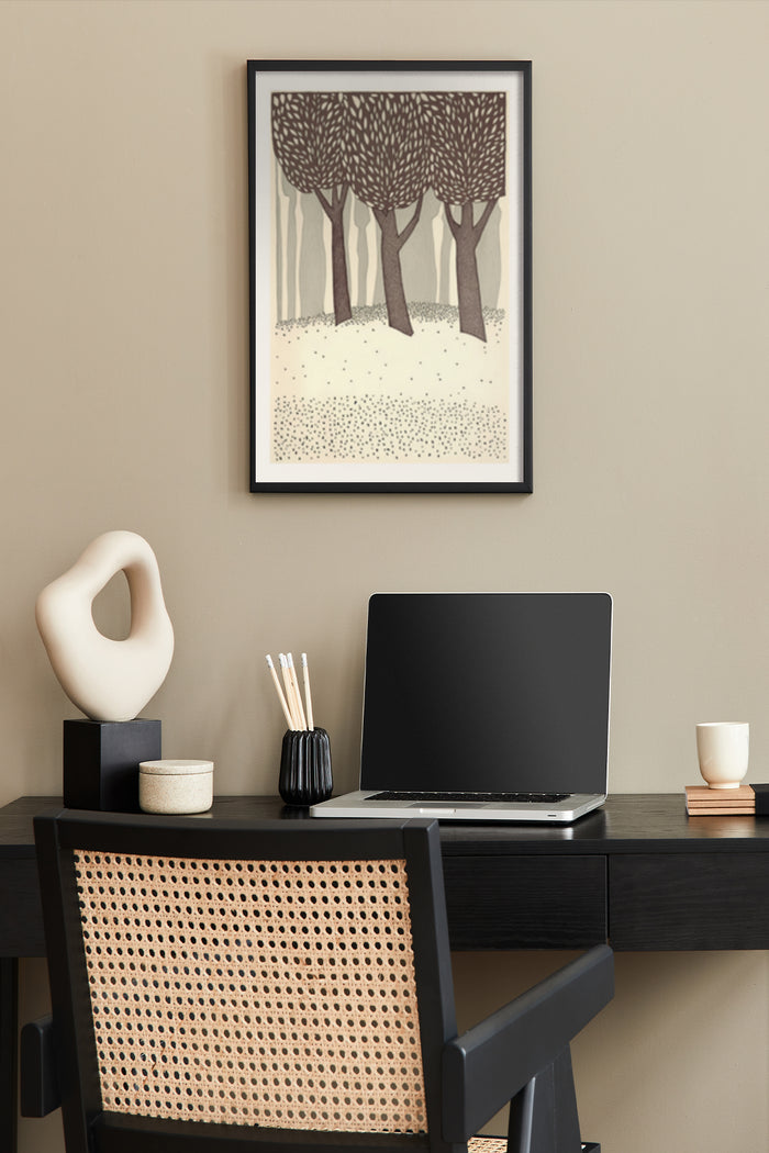Abstract tree artwork with geometric patterns displayed above a black desk with laptop in a stylish home office