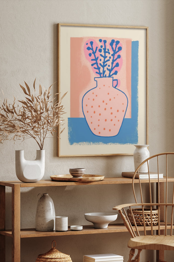 Modern art poster featuring a vase with leafy plants, positioned on a wall in a stylish interior with wooden furniture and ceramic decorations