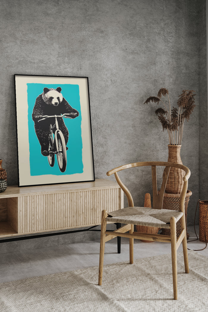 Contemporary poster of a bear riding a bicycle displayed in a stylish living room setting