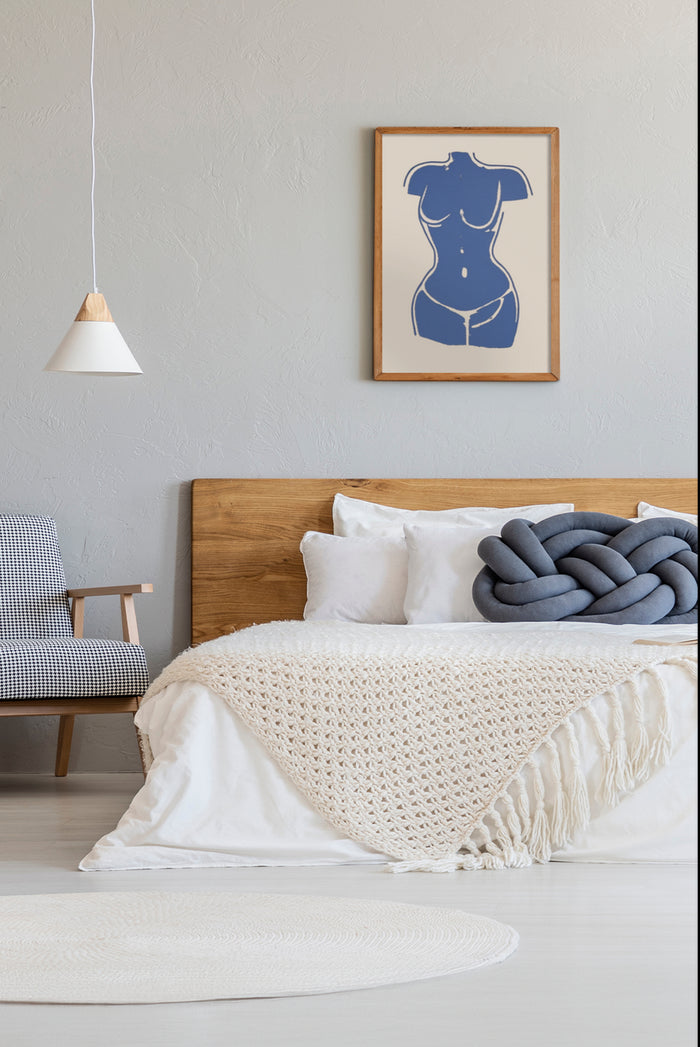 Stylish bedroom with minimalistic abstract female figure artwork in a cozy home setting