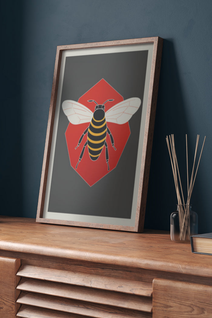 Modern bee artwork on poster in a framed picture displayed on a wooden sideboard in an interior setting