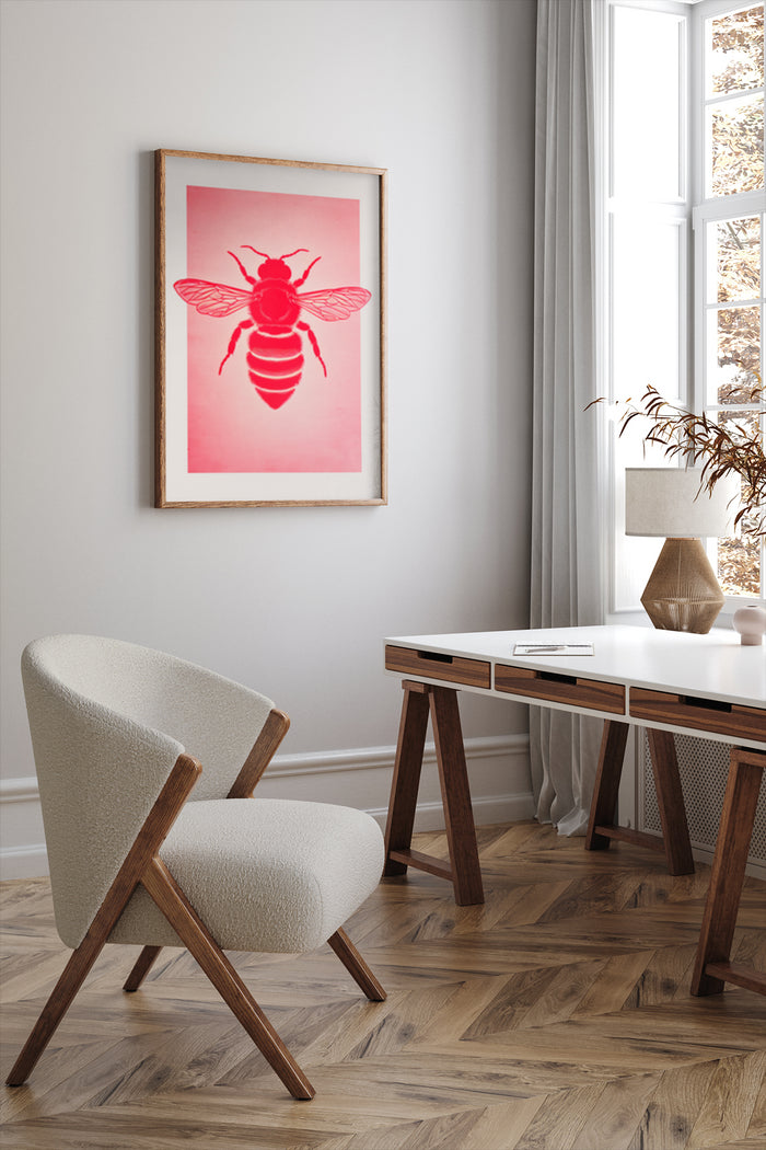 Contemporary red and white bee illustration in a wooden frame on a wall in a stylish interior with chair and desk