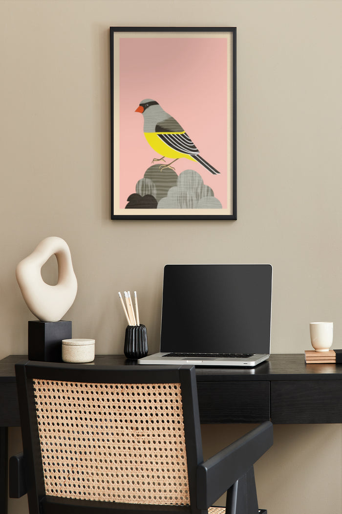 Stylish bird illustration poster framed on a home office wall, with a laptop on the desk and decorative items