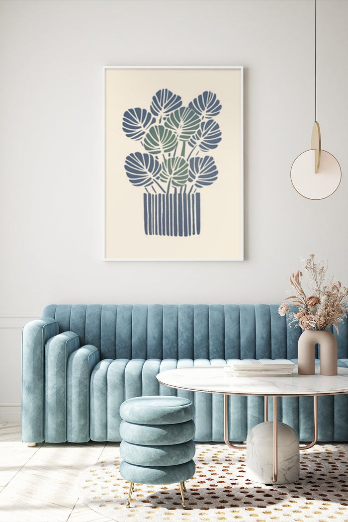 Stylish blue botanical artwork poster displayed in a modern living room with velvet couch and chic interior design