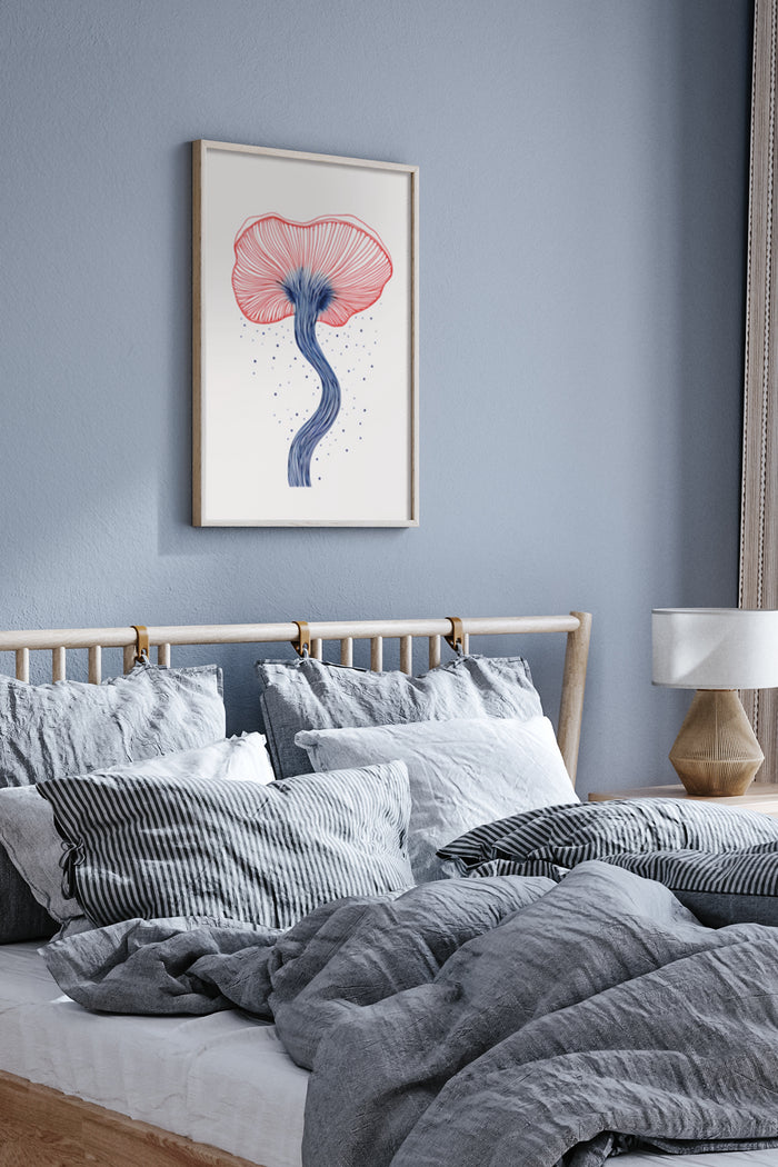 Contemporary blue and pink jellyfish illustration in a white frame on a bedroom wall