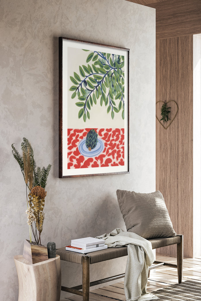 Modern botanical artwork poster with green leaves and a red and blue pattern displayed in a cozy interior setting