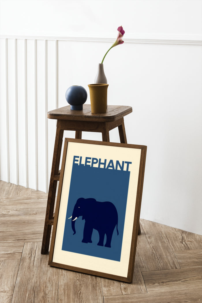 Stylish modern elephant art poster displayed on an easel with decorative vase and flower in a contemporary room