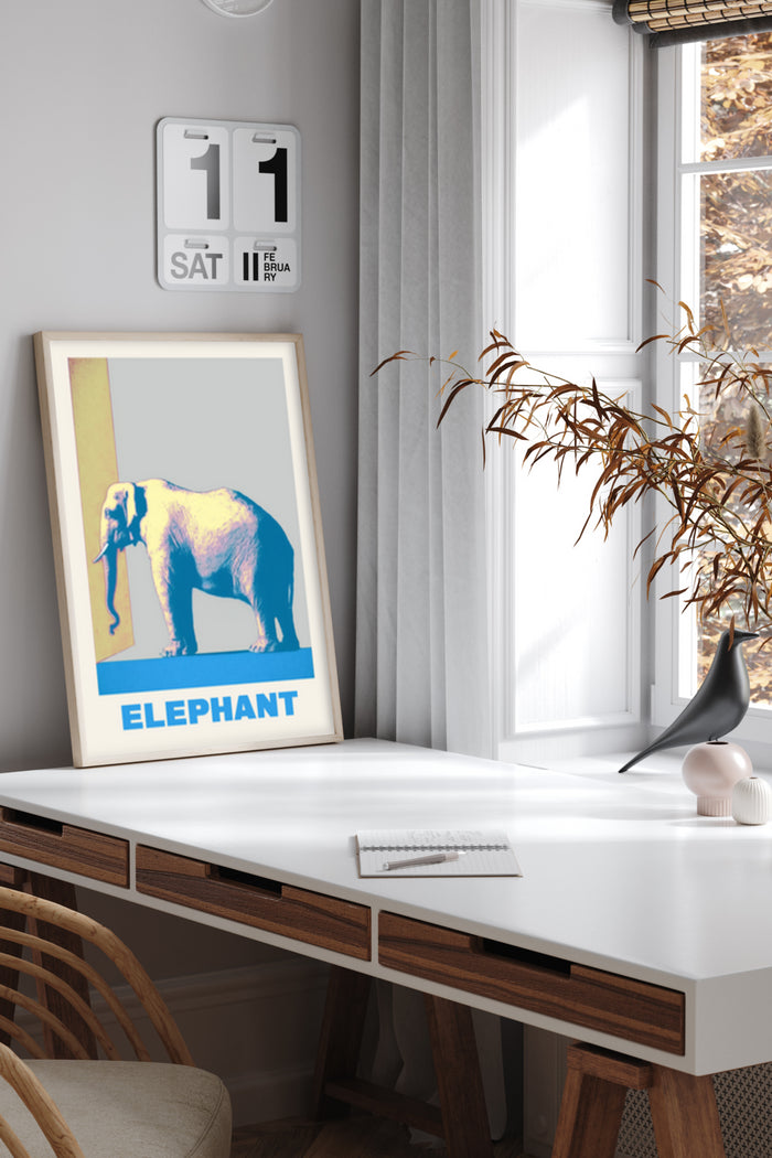 Contemporary elephant poster artwork displayed in a stylish home office setting