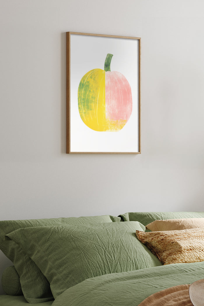 Modern Artwork of a Split Yellow and Pink Pumpkin in a Frame Above a Green Bed
