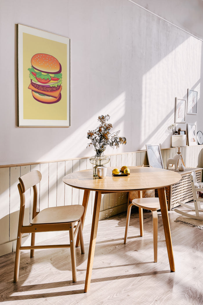 Stylish dining room with wooden furniture and vibrant burger poster on the wall