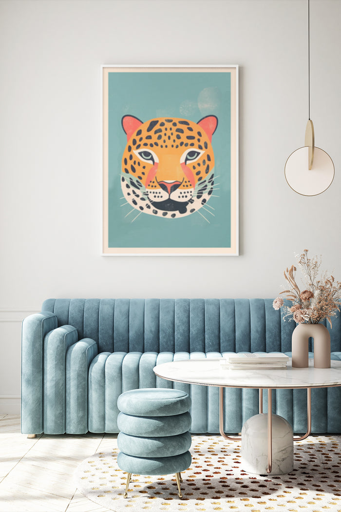 Stylish modern leopard artwork print hanging on wall above blue velvet sofa in contemporary living room