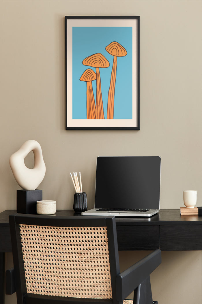 Modern minimalist mushroom artwork in a poster frame above a home office desk