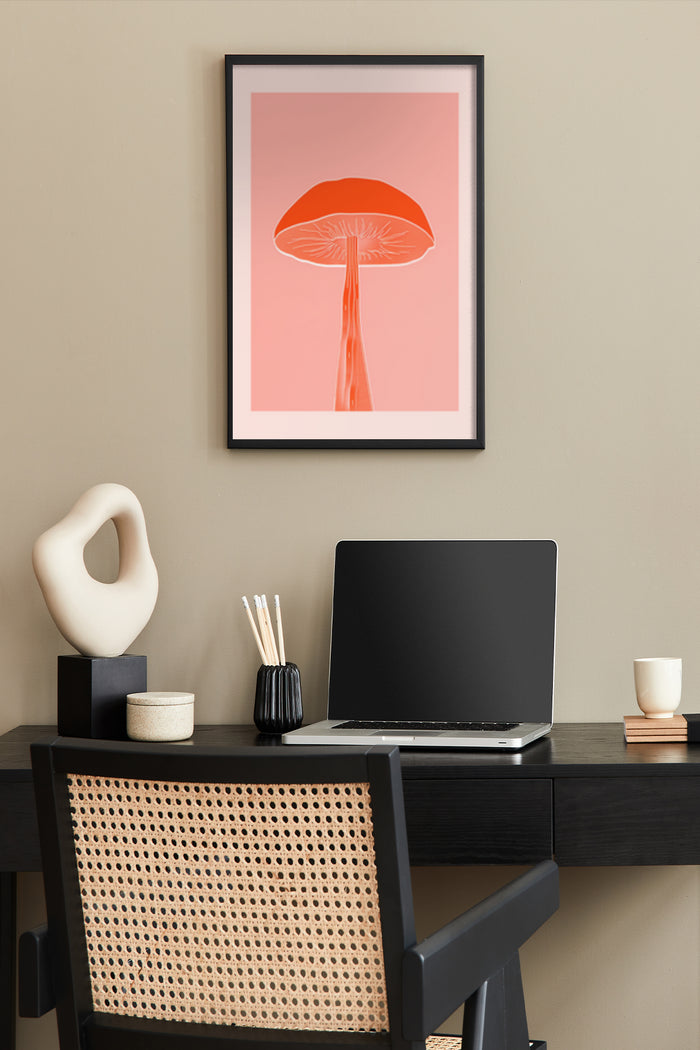 Modern minimalist red mushroom poster on a wall in a stylish home office setup