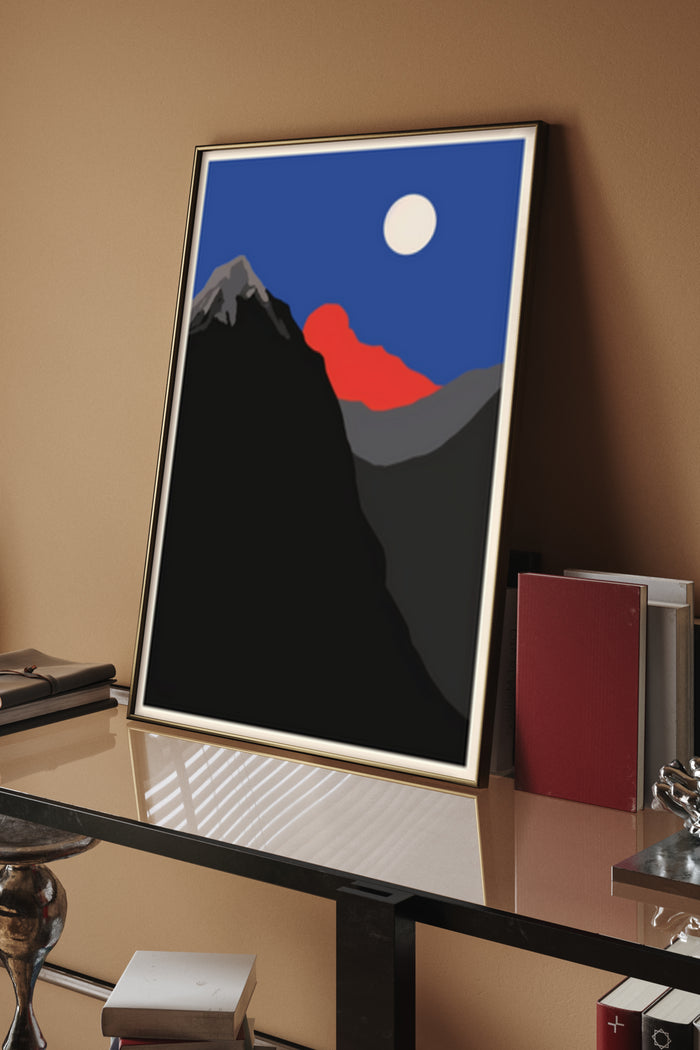Contemporary mountain landscape poster with red and gray peaks under a round moon in an elegant office environment