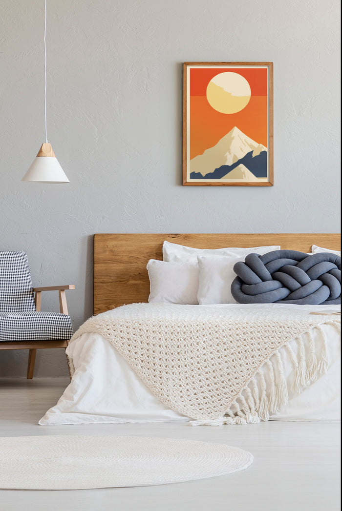 Stylish bedroom with a modern mountain sunrise poster on the wall, white bedding, and designer armchair