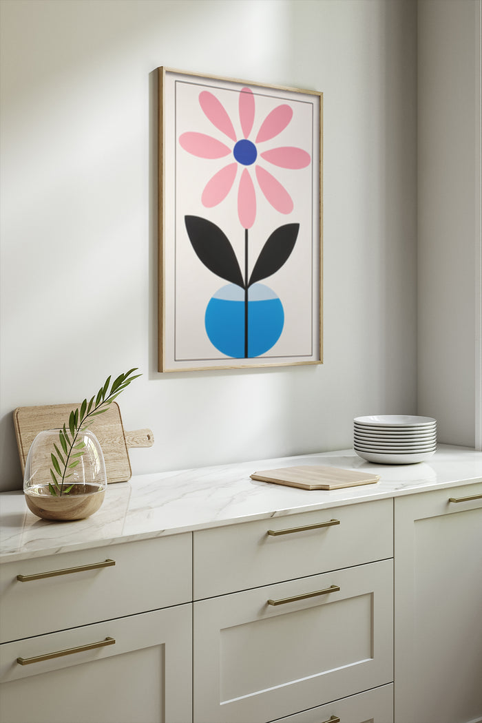Modern pink and blue flower poster framed on wall in a contemporary kitchen setting with natural lighting.