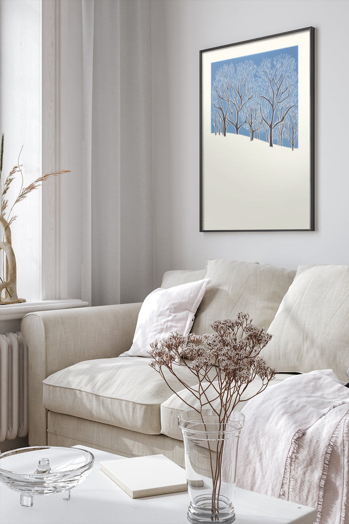 Modern art print of blue winter trees in a contemporary living room setting