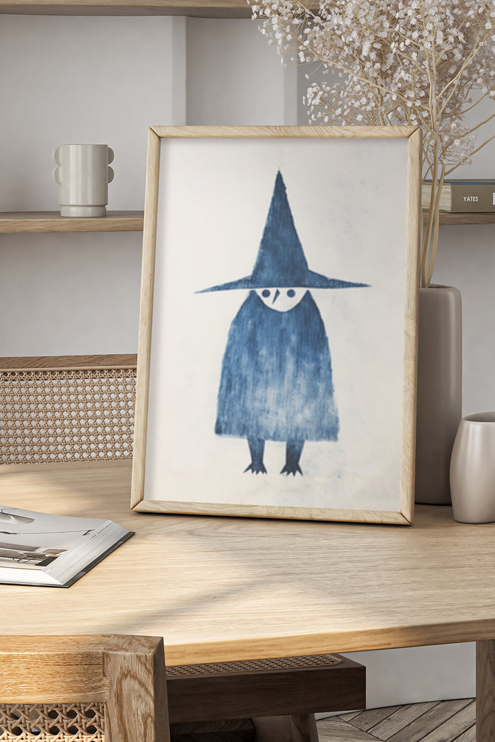 Contemporary blue witch painting in natural wood frame on a stylish table with decorative items