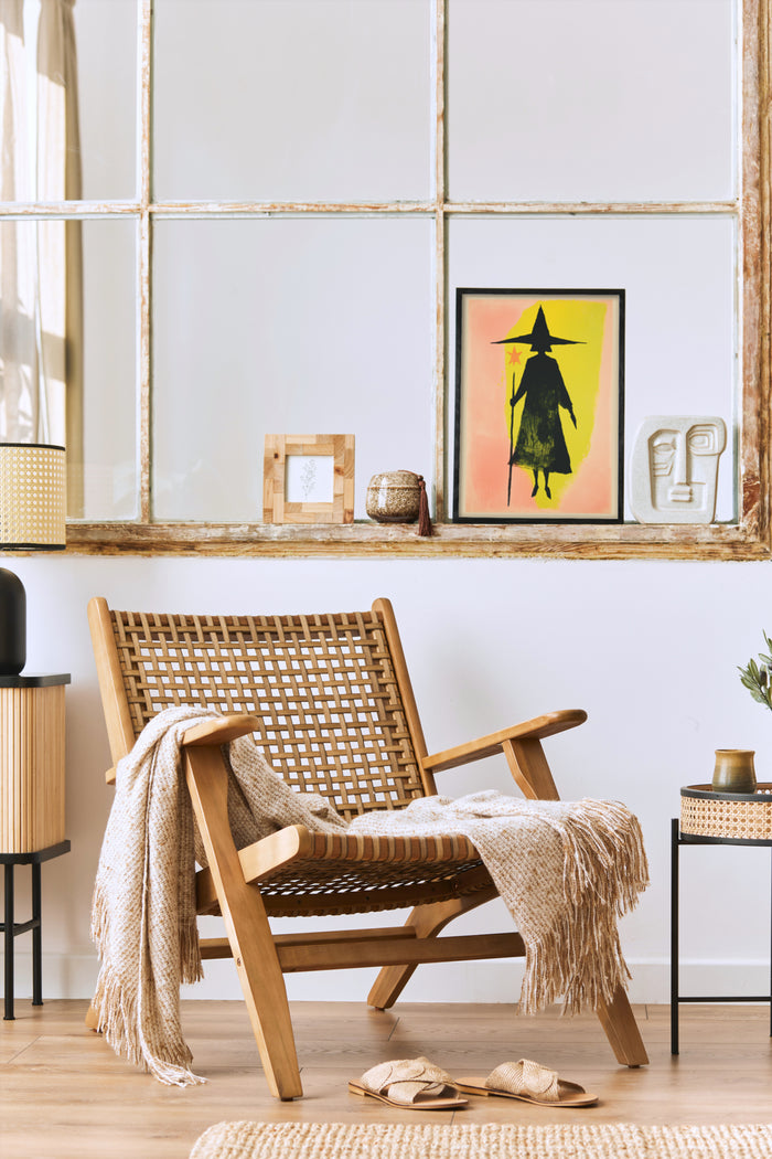 Contemporary home interior featuring modern witch artwork poster in a warm cozy setting with wooden furniture