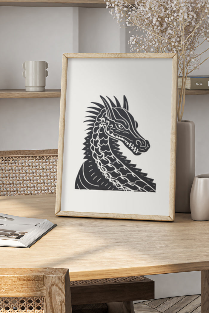 Black and white dragon illustration poster in a wooden frame on a stylish shelf