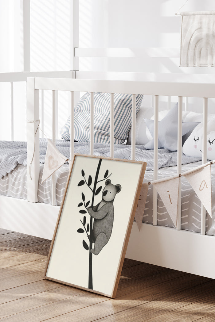 Nursery room decoration with a framed poster of a koala on a tree