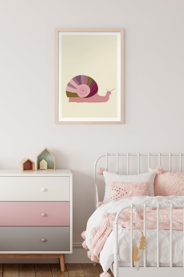 Pastel colored snail illustration poster framed on a nursery room wall above a modern dresser