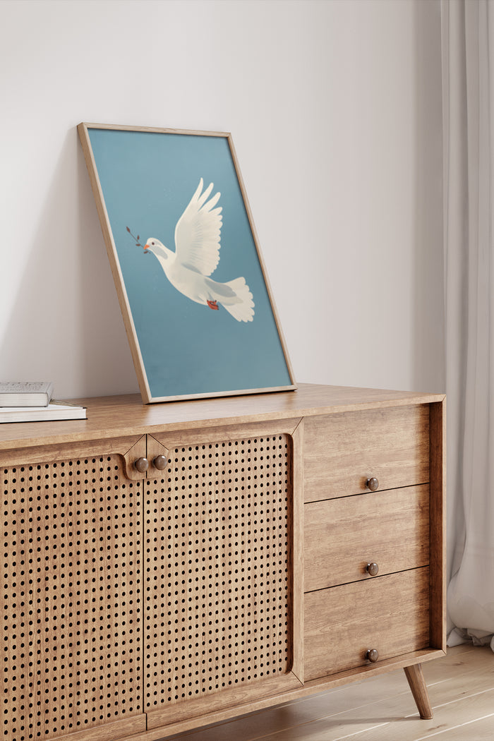 Modern peace dove poster artwork in a wooden frame on a cabinet in a contemporary room