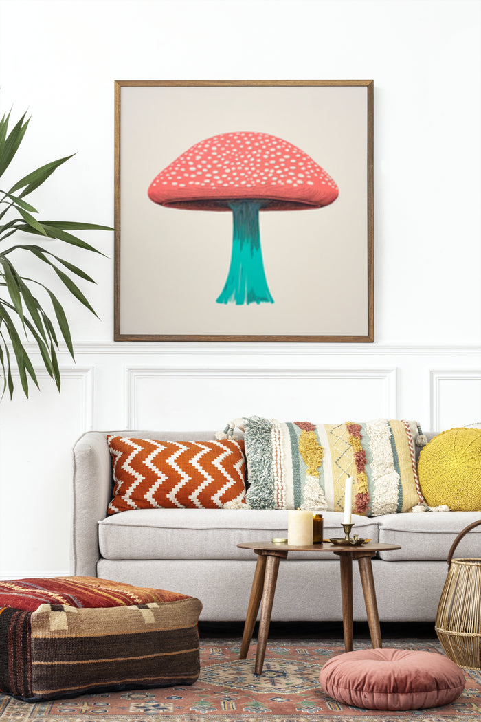 Modern living room with framed red spotted mushroom artwork above a comfortable sofa with colorful cushions