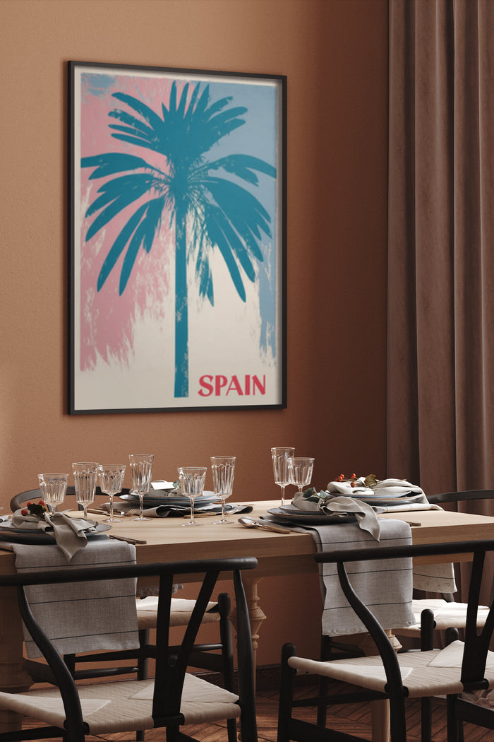 Vintage Spain travel poster featuring a palm tree with pink and blue background, displayed in a dining room